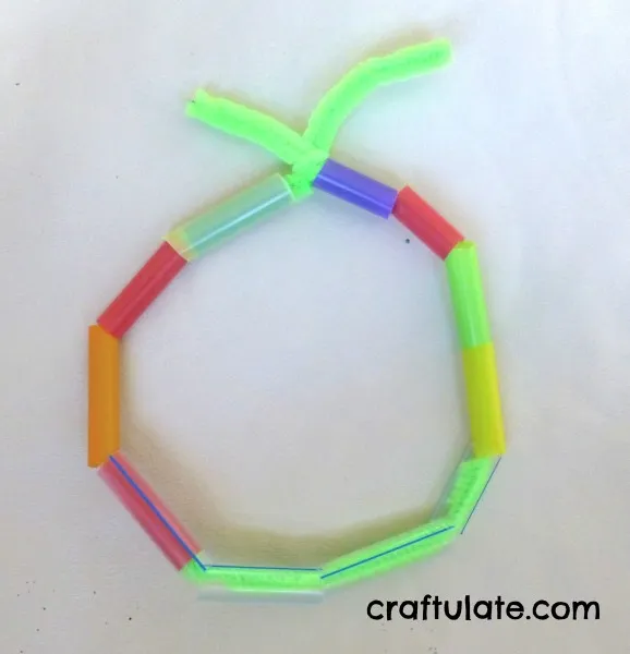 Straw bracelet with green pipe cleaner- red- purple- orange straw beads